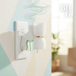 Styled lifestyle image of a plug-in fragrance warmer with a glass oil refill installed on a patterned wall with subtle steam effect