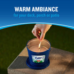 Top view of a hand lighting a Cutter blue bucket candle with headline 'warm ambiance for your deck, porch or patio'