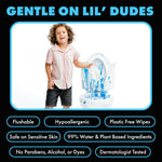 Child standing beside a paint-splattered toilet holding a wipe, LiL' Dude Wipes feature badges for flushable and hypoallergenic