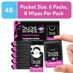 Hand holding a single black and pink Lil' DUDE Wipes pocket pack with stacked packs and package art showing 6 pocket packs.