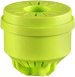 Another angled close-up of a lime-green bait cartridge showing top vent slots and lower skirt detail against white