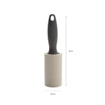 Lint roller with gray handle and measurements indicating 9.1 in height and 2.2 in roll diameter