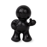 Close-up of glossy black Little Joe figurine car air freshener on white background