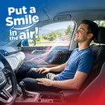 Man relaxing in a car interior with stylized scented air swirls and large text 'Put a Smile in the Air' promoting Little Joe fragrance.