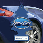 Blue Little Trees tree air freshener with “New Car” logo hanging in front of a blue car wheel and body