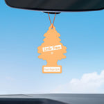 Peach-colored Little Trees air freshener hanging from a rearview mirror against a blue sky, labeled 'Peach Ginger Spritz'