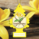 Close-up of a yellow Little Trees Vanillaroma tree air freshener with vanilla flower and pods in blurred background