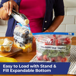 Person using tongs to load fruit into a Hefty slider bag with another labeled bag on the table
