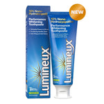Blue Lumineux toothpaste tube and matching box standing side by side on white, labeled performance whitening toothpaste.