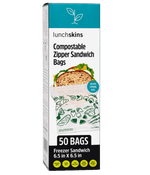 Tall product box of Lunchskins compostable zipper sandwich bags showing a bag with printed green icons and '50 BAGS' label.