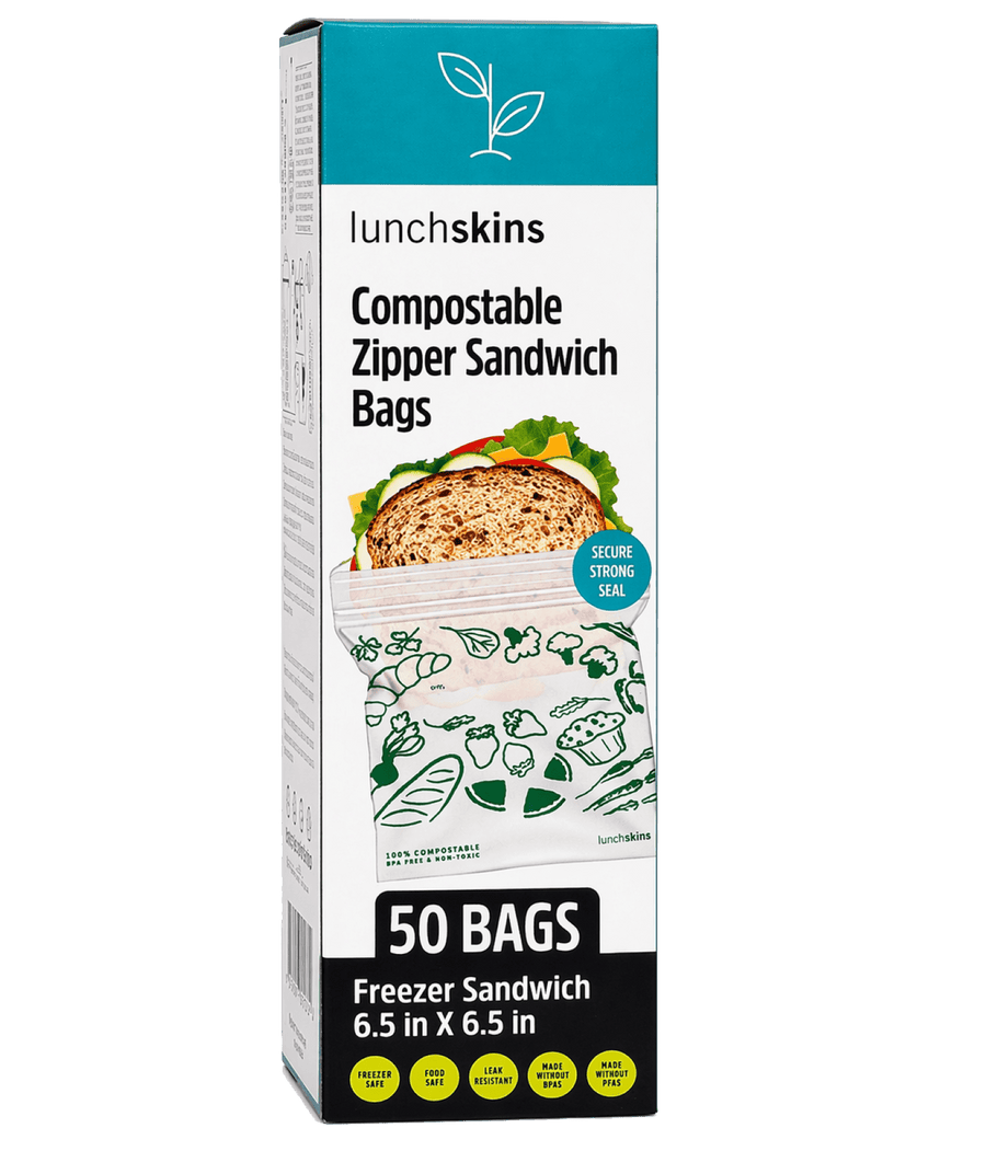 Tall product box of Lunchskins compostable zipper sandwich bags showing a bag with printed green icons and '50 BAGS' label.