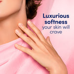 Close-up lifestyle image of a woman's hand and neck next to text 'Luxurious softness your skin will crave'