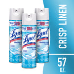Three Lysol crisp linen disinfectant spray cans arranged on a blue background with vertical CRISP LINEN text and 57 oz callout