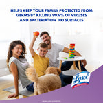 Smiling family playing on floor with a dog and headline about killing 99.9% of viruses and bacteria above the Lysol logo