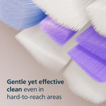 Macro close-up of soft blue and purple bristles on a Philips Sonicare S2 replacement brush head