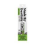 Front view of Made By Dentists toothbrush box with product window and dinosaur illustration on white and green packaging