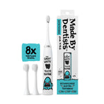 Made By Dentists white kids electric toothbrush with shark graphic, two replacement heads and retail box on white background.