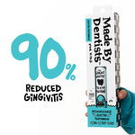 Retail box for Made By Dentists shark electric toothbrush held by a hand with large '90% reduced gingivitis' graphic to the left.