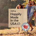 Wood-grain panel stating ‘Happily Made in the USA’ over a background of a family walking outdoors.