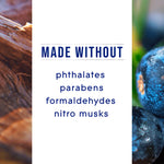 White panel reading 'MADE WITHOUT' followed by a list of chemicals, flanked by close-ups of wood and berry textures