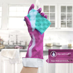 Magenta rubber glove holding a soapy green and blue sponge with a kitchen sink and cabinets blurred in the background and a drip-catch cuff callout.
