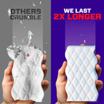 Side-by-side comparison showing a crumbled competitor eraser and an intact Mr. Clean Magic Eraser with text claiming it lasts 2X longer