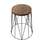 Top-down three-quarter view of round acacia wood tabletop and black geometric wire base plant stand on white background