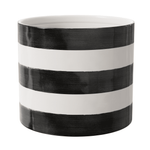 Glossy ceramic round planter with bold black and white horizontal stripes, empty interior visible
