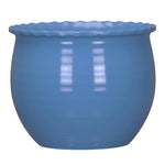 Glossy blue rounded planter with a scalloped rim shown against a white background