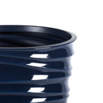Close-up detail of glossy ribbed swirl texture and rim on a Blue Cove Mainstays Capri planter