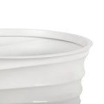 Close-up crop of the planter rim and upper ribbed exterior in a cream glossy finish