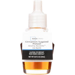 Fragrance oil refill bottle with white cap and product label reading Cinnamon Sugared Pretzel on white background