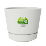 Front view of vanilla-colored round planter with green circular product label affixed to its exterior