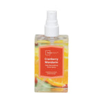 Full Mainstays Cranberry Mandarin room spray bottle with white nozzle and colorful fruit label on white background