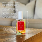Mainstays Cranberry Mandarin spray bottle on wooden table with infographic text and product dimensions overlaid