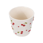 Overhead view into an empty cream ceramic planter showing interior and exterior cherry pattern