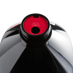 Top-down view into the bottle opening showing the red EZ-fill spout insert inside the black plastic jug.