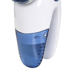 Detail view of the translucent blue lint reservoir attached to the white Mainstays fabric shaver body
