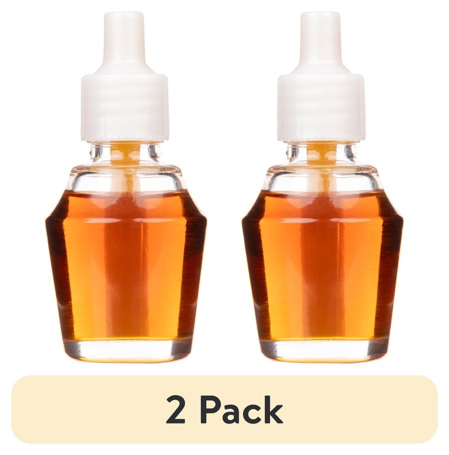 Two clear glass fragrance oil refill bottles with amber liquid and white caps labeled 2 pack