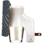 Side profile of a Mainstays plug-in fragrance diffuser showing textured dark cover, white plastic body, and oil vial.