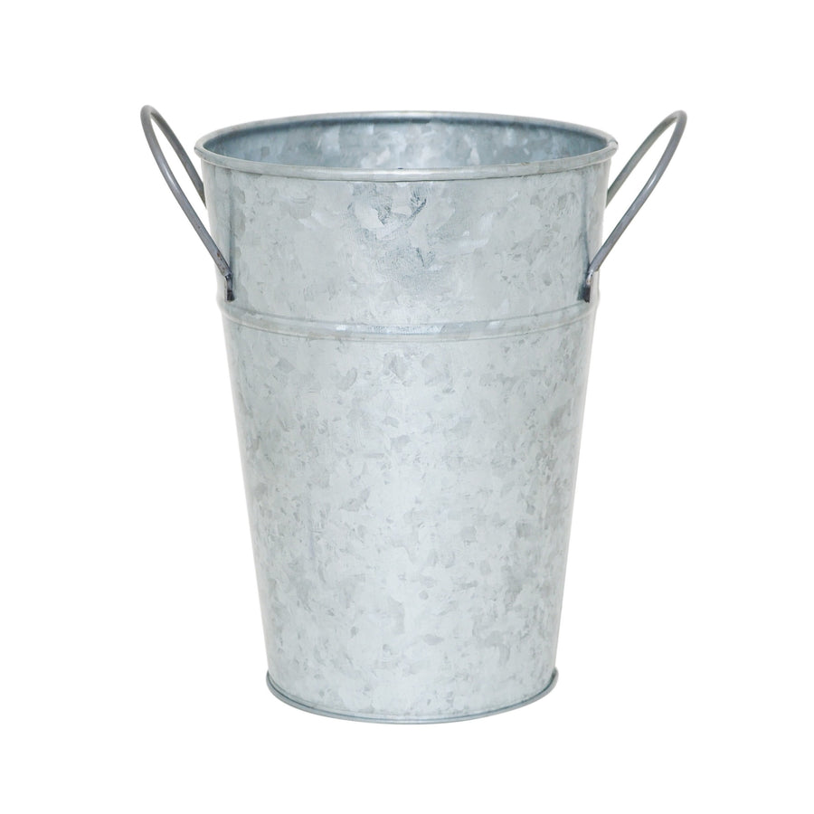 Single galvanized metal bucket planter with tapered body and two looped side handles on white background