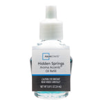 Clear glass refill bottle with blue-green fragrance oil and a white plastic screw cap label reading Hidden Springs Aroma Accents.
