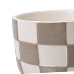 Close-up of the top rim and upper side of a birch gray checkered ceramic planter showing glossy finish