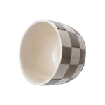 Ceramic planter photographed at an angle showing interior cavity and checkered exterior glaze in birch gray