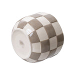 Planter lying on its side showing the round base and checkered birch gray glaze pattern on the exterior