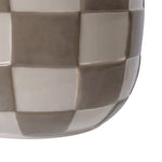 Cropped detail view of the side of a checkered ceramic planter showing alternating birch gray and cream squares