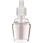 Close-up clear glass Mainstays oil refill bottle filled with pale liquid and white plastic cap
