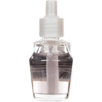 Top-down view of a Mainstays glass oil refill bottle showing white cap and pale liquid inside
