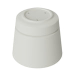 Vanilla-colored plastic planter shown upside down to reveal molded base and drainage holes