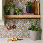 Kitchen shelf vignette showing multiple Mainstays planters with herbs and a cutting board against patterned tile backsplash